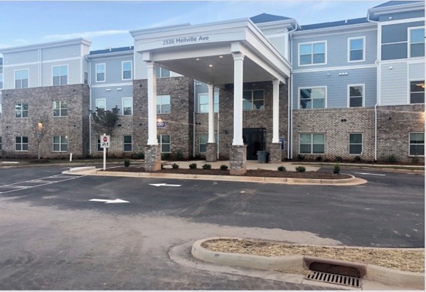 Multifamily building exterior shown in company capability statement